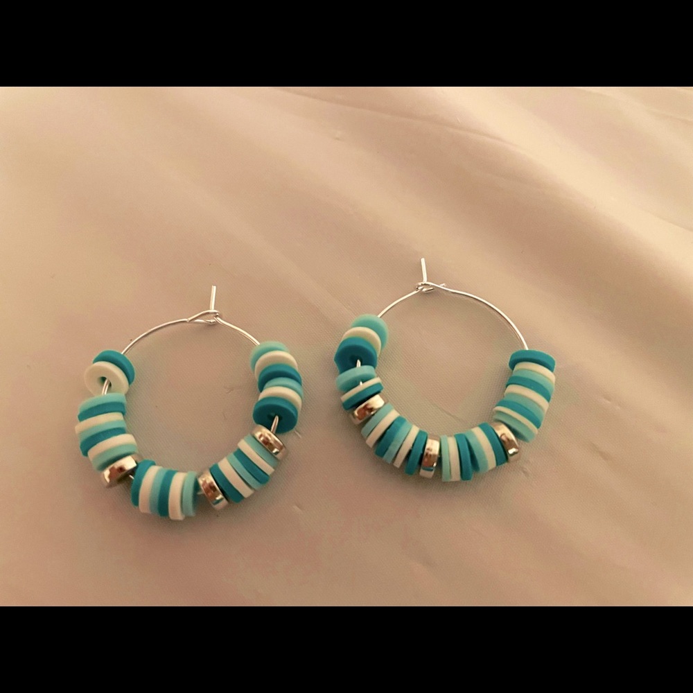 polymer clay earrings.  1 inch silver hoops.  teal/white/silver beads